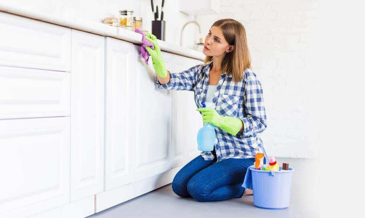 woman cleaning the kitchen counter